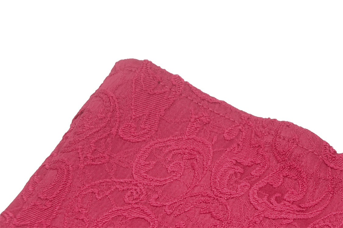 Close-up of burgundy lace fabric showing intricate floral patterns for a corset design.