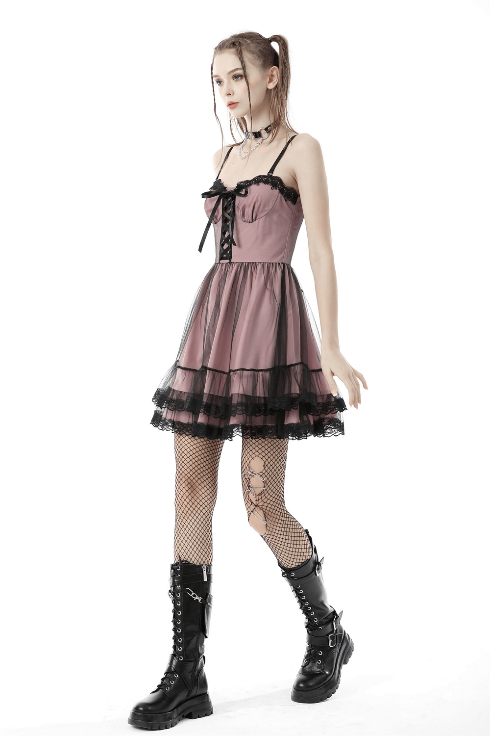 Elegant lace-up gothic mini dress with ruffled hem, black lace accents, and stylish fishnet stockings.