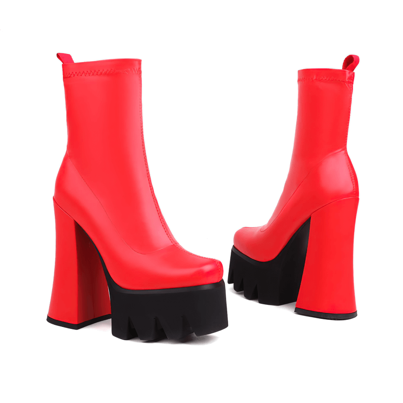 Stylish red high heel boots with chunky black platform, perfect for a casual yet fashionable look.