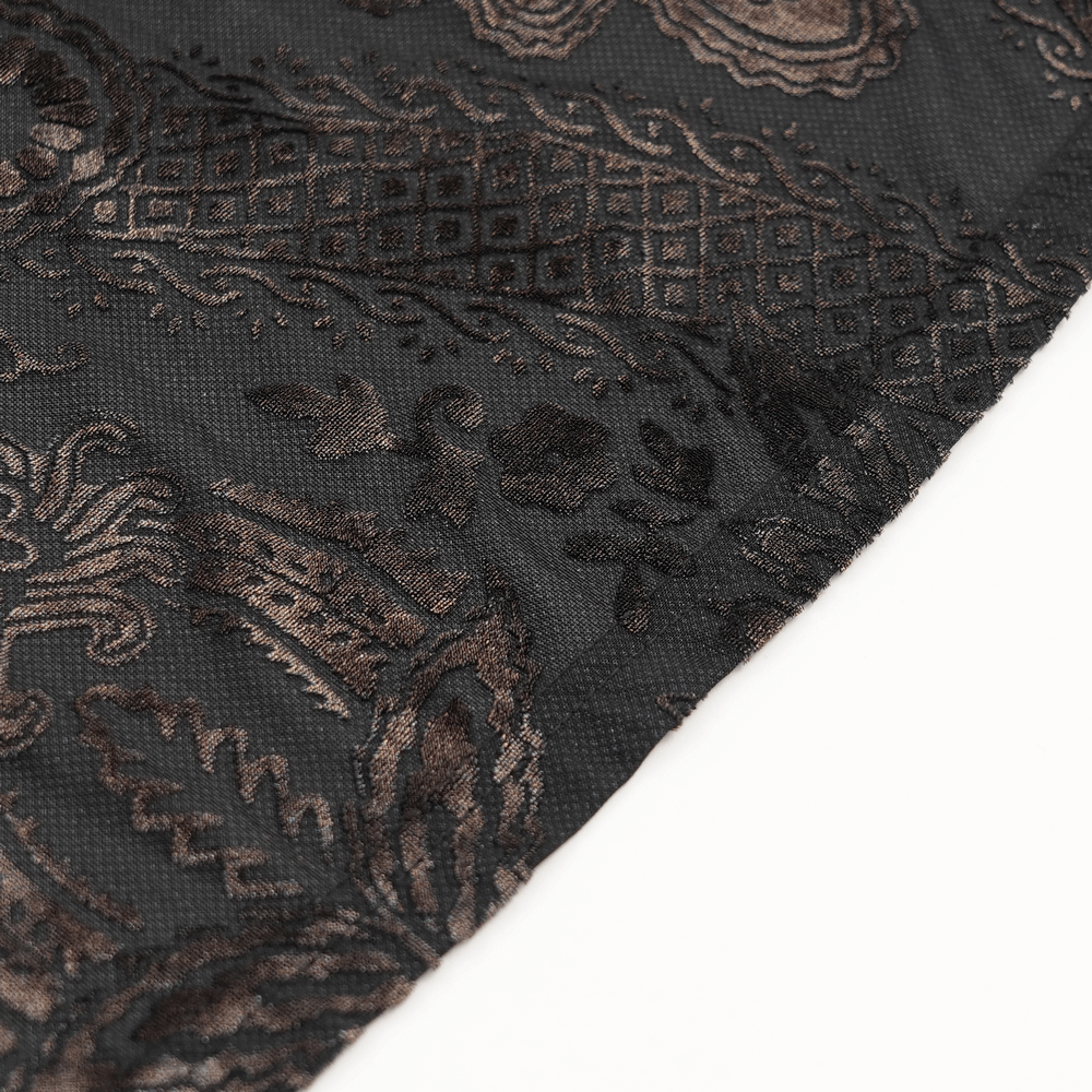 Close-up of elegant black fabric with intricate gothic floral patterns and texture for fashion details.