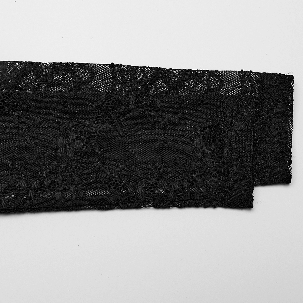 Close-up of intricate black lace fabric, showcasing elegant floral patterns and delicate detailing for stylish designs.