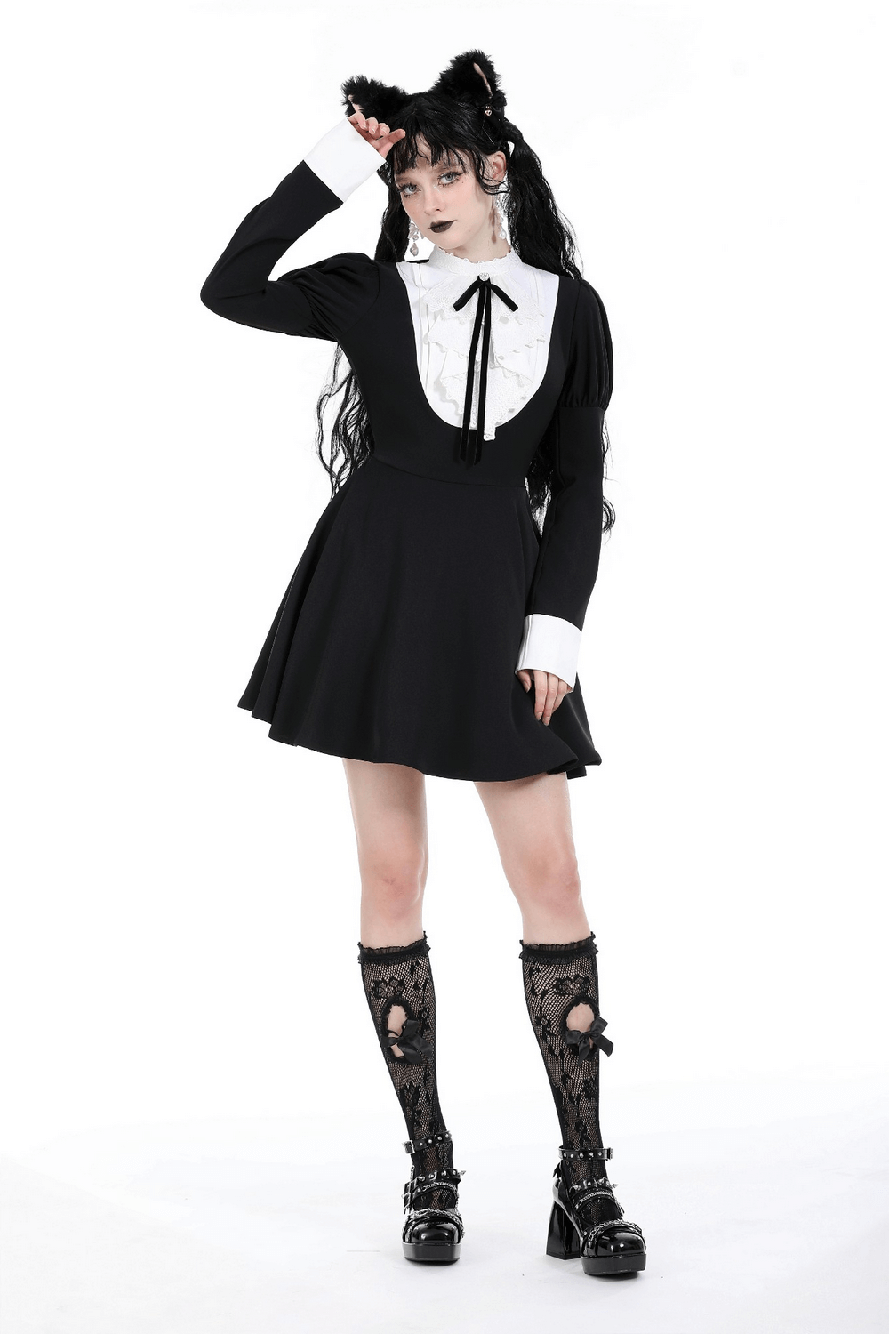 Chic black long sleeves dress with white ruffled collar and bow detailing, perfect for stylish gatherings.