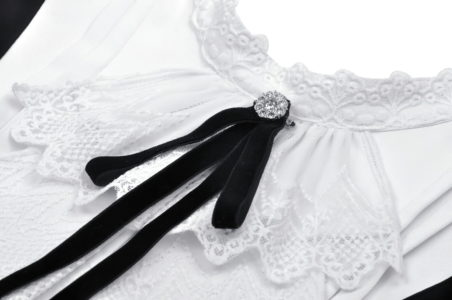 Elegant white ruffled collar with black bow detailing on a chic dress for women, perfect for special occasions.