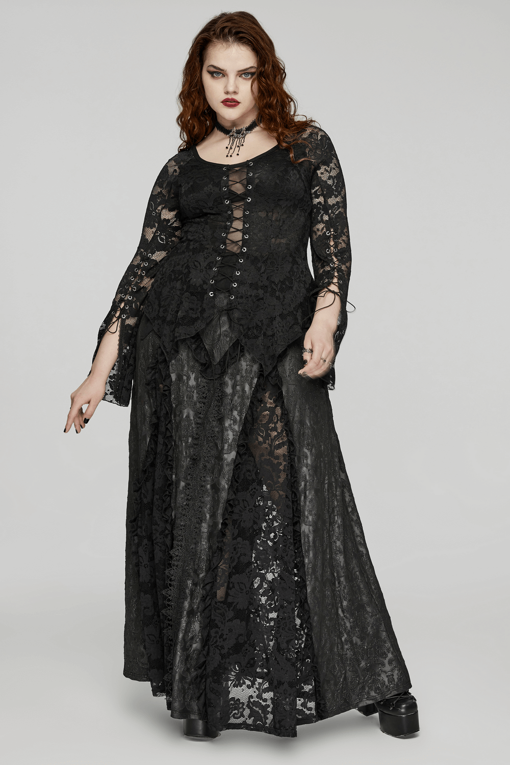 Chic black lace long-sleeves top with unique straps and elegant flowy design, perfect for stylish women.