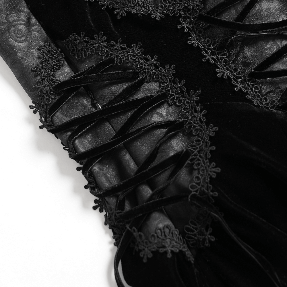 Close-up of an elegant black maxi dress featuring a lace corset and intricate beaded details.
