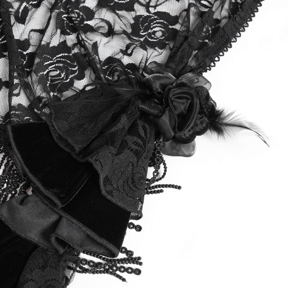Close-up of a black lace fabric featuring intricate floral patterns and elegant beaded details.