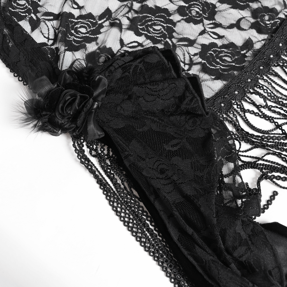 Elegant black lace detail with floral accents and beaded fringe, perfect for a chic maxi dress.