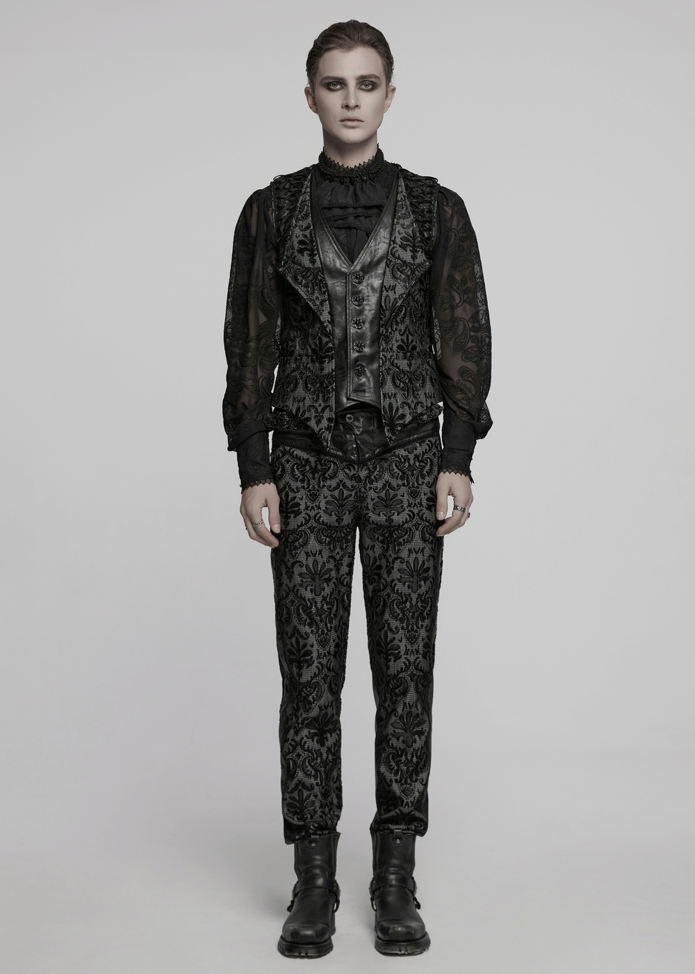 Elegant gothic outfit model showcasing embroidered brocade waistcoat and intricate black patterns.