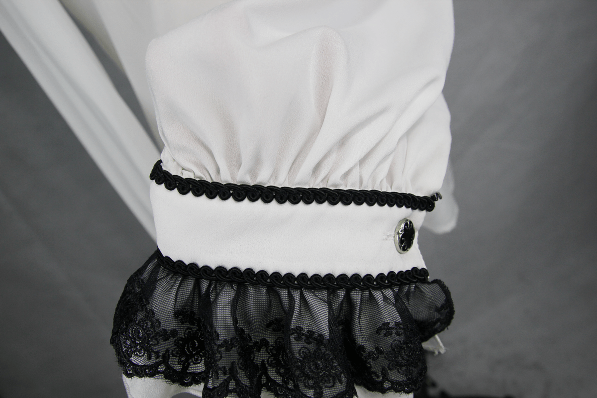 Close-up of an elegant white gothic shirt sleeve with black lace and intricate detailing, perfect for vintage styling.