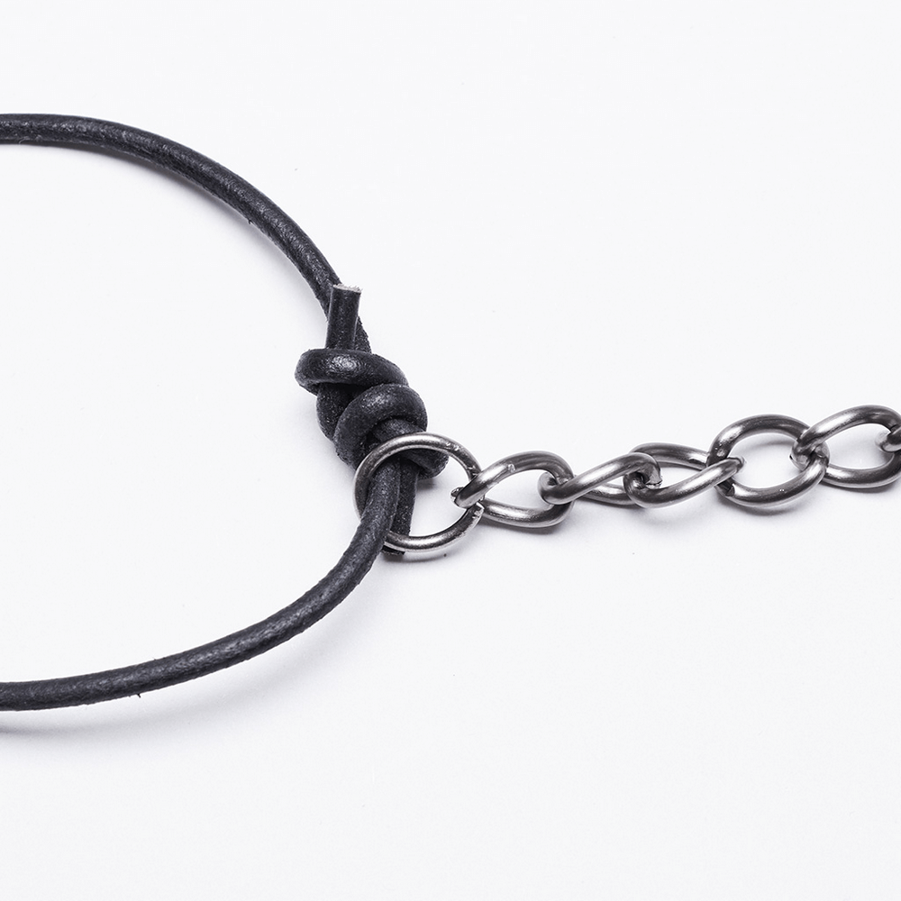 Close-up of a stylish black leather and chain body harness detail, perfect for elevating trendy outfits.
