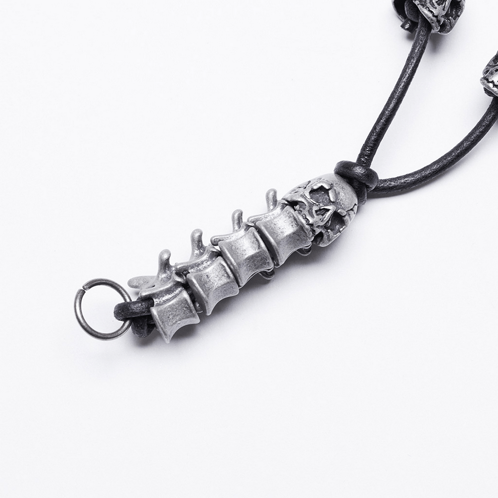 Unique silver spine pendant on leather cord, perfect for edgy accessory lovers.