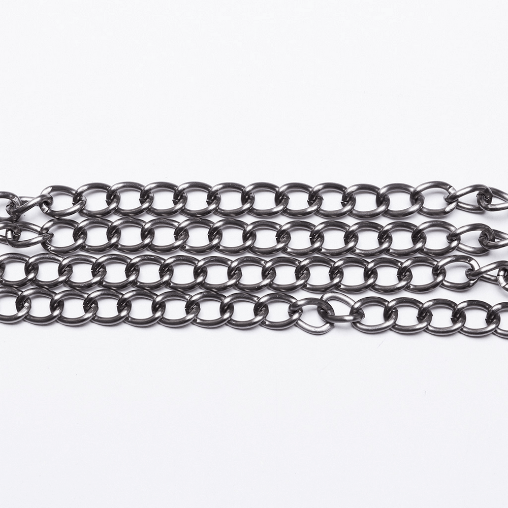 Elegant multi-chain body harness with intricate black links for chic layering in trendy outfits.