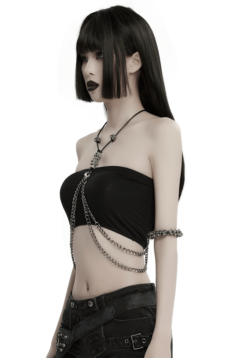 Chic model showcasing an elegant multi-chain body harness layered over a sleek black top, perfect for stylish outfits.