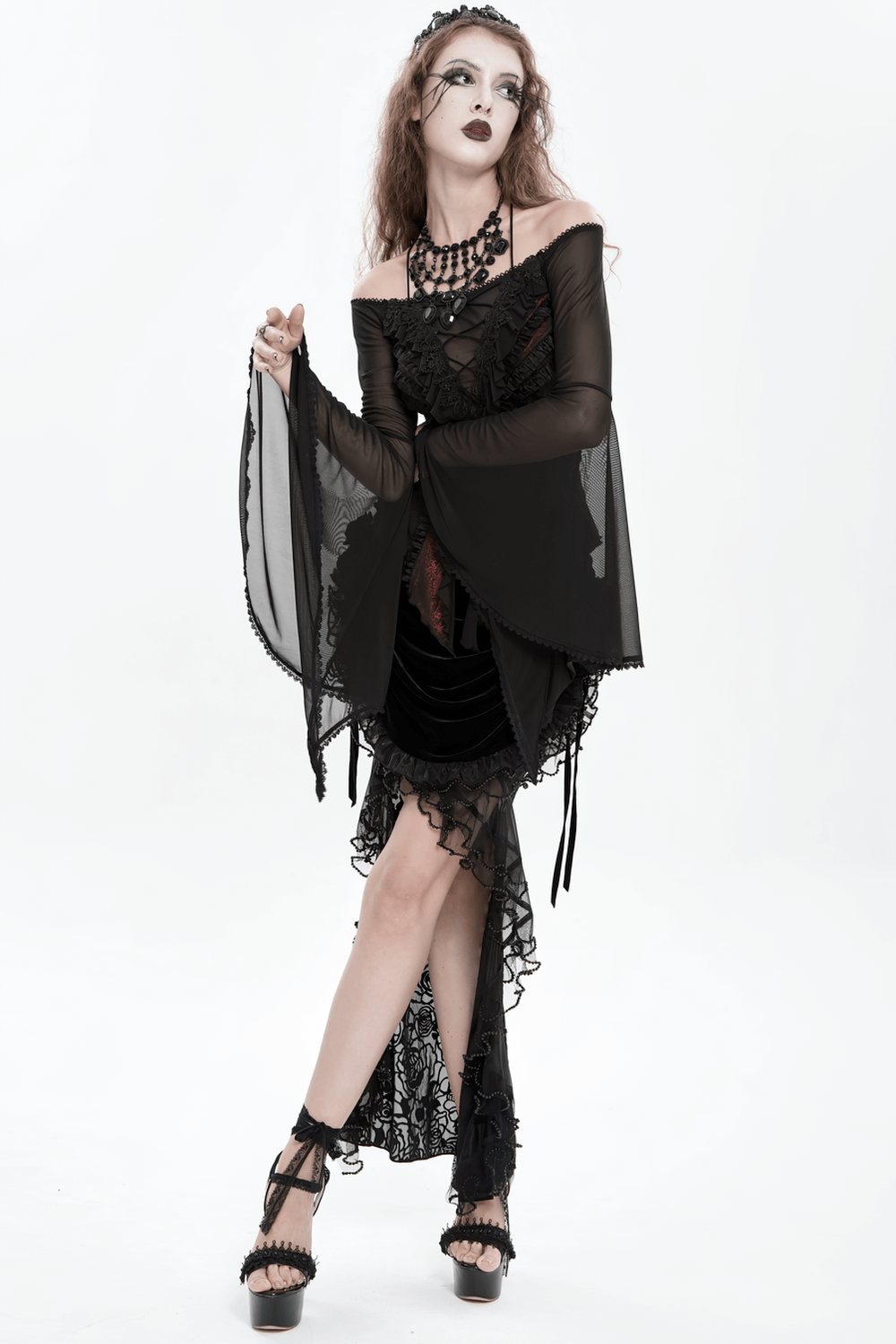 Elegant Off-Shoulder Ruffle Top with Sheer Sleeves and Lace displayed on a model in a gothic setting.