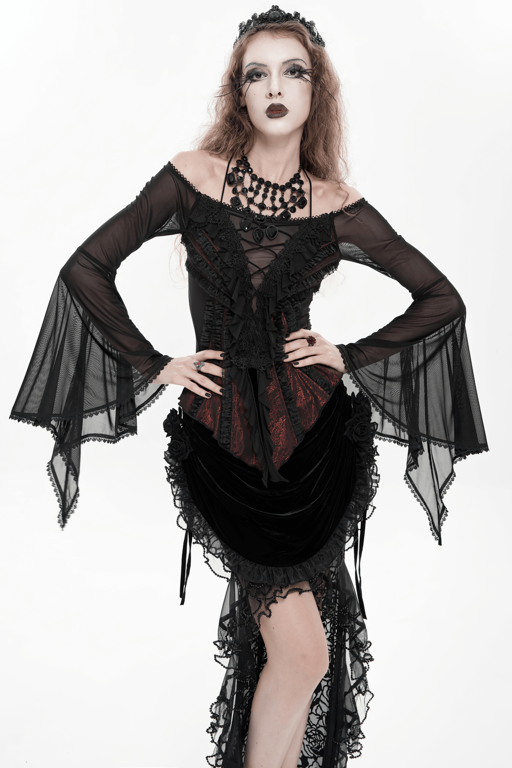 Elegant Off-Shoulder Ruffle Top with Sheer Sleeves and Lace modeled by a gothic model in dramatic black attire.