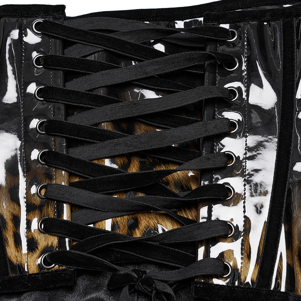 Close-up of a leopard print patent leather corset showcasing black lace-up detailing and glossy finish.