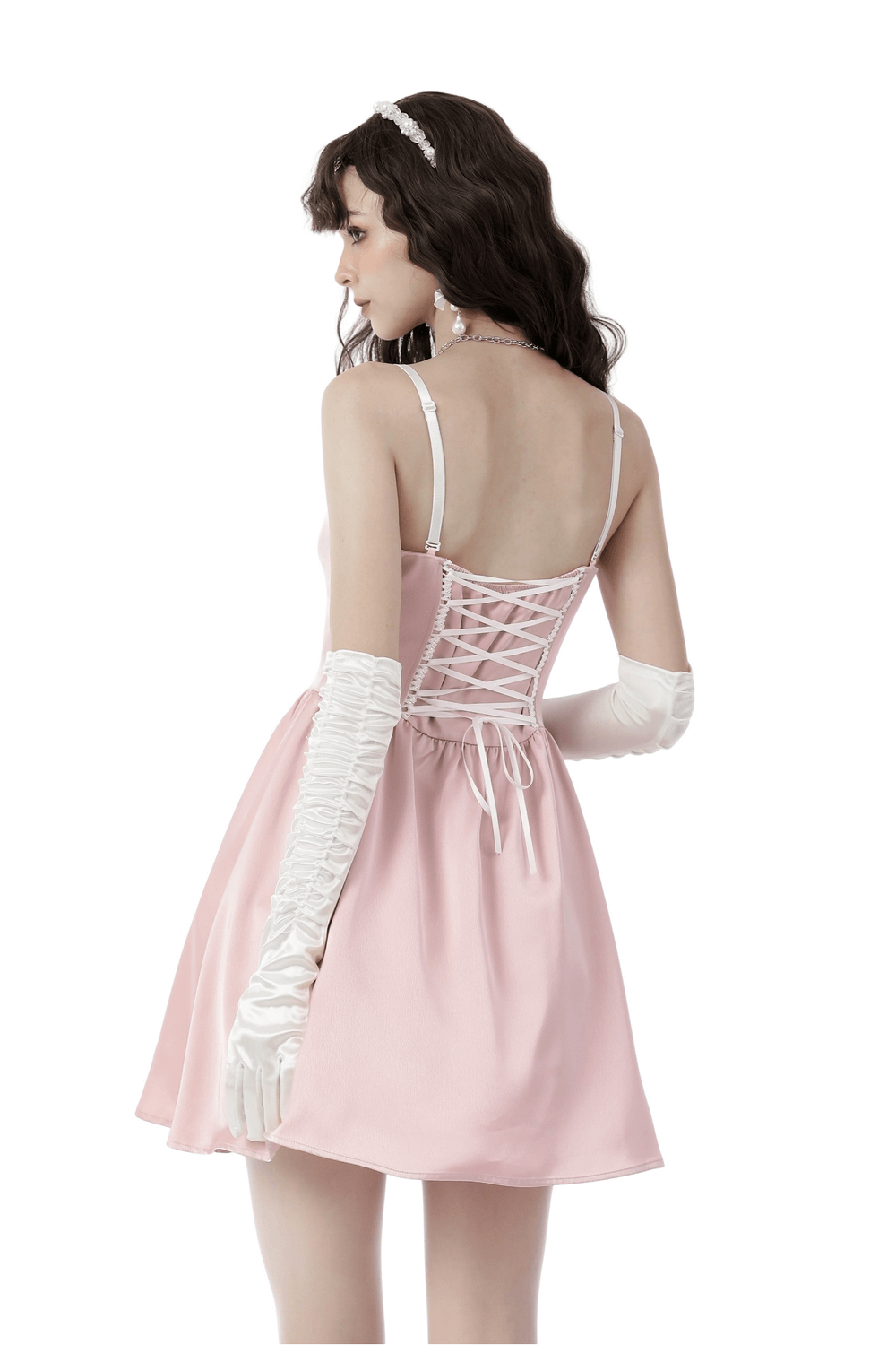 Back view of a chic pink satin A-line dress with a delicate bow and lace-up detail, perfect for evening events.