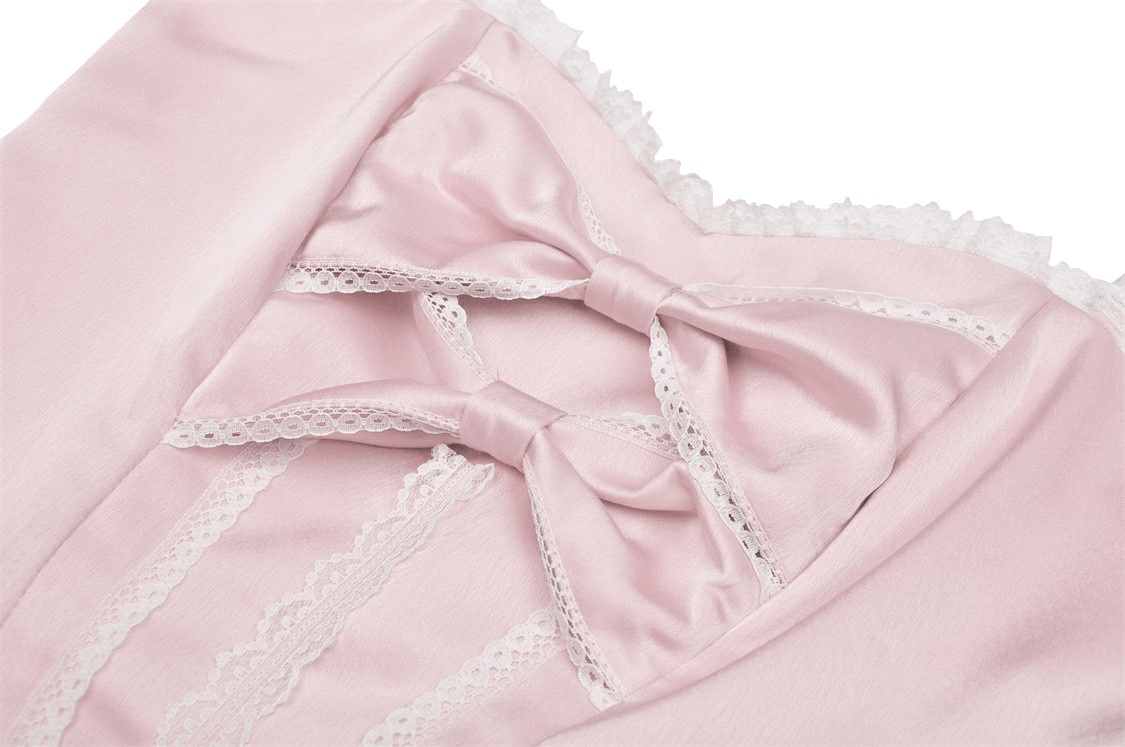 Elegant pink satin dress featuring delicate bows and intricate lace detailing, perfect for evening events.