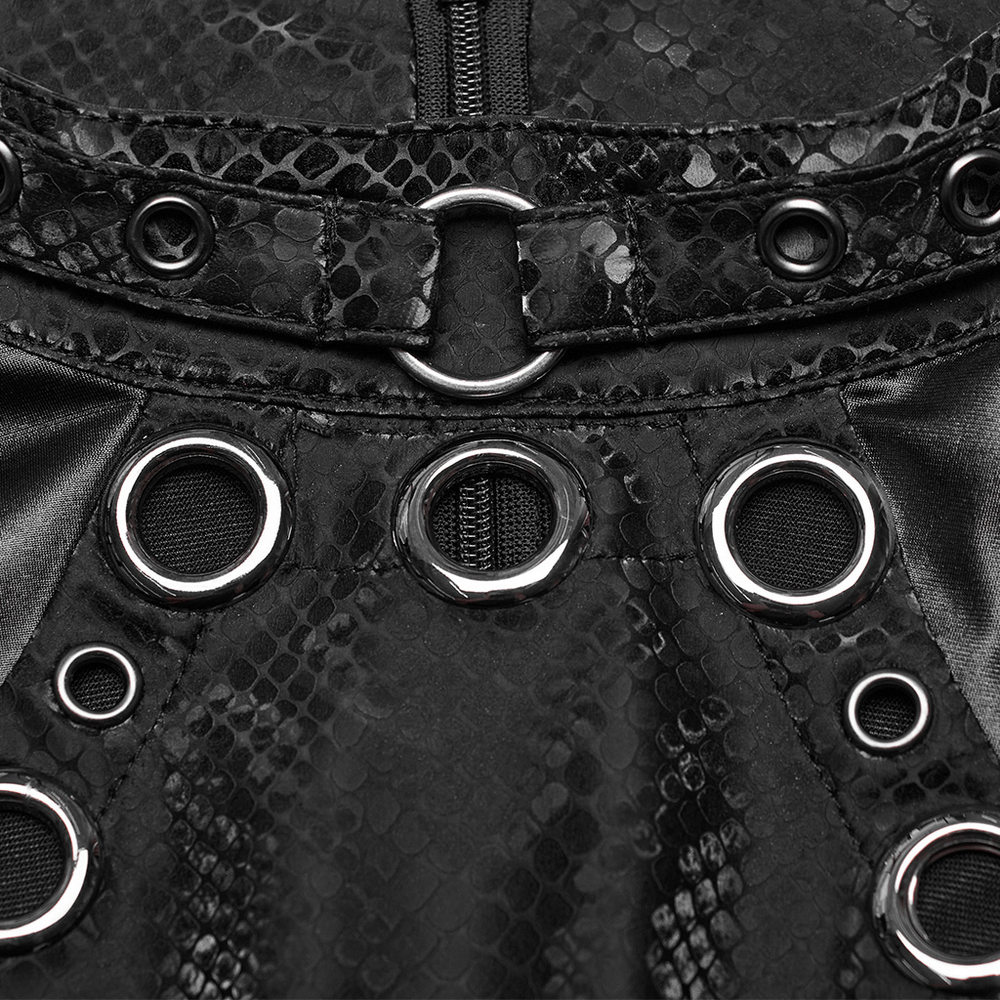 Close-up of edgy black snake print vest showing detailed embellishments and zip closure.
