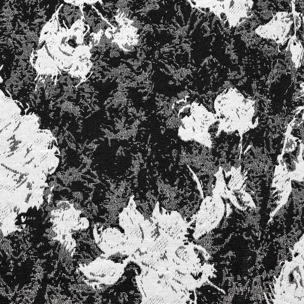 Close-up of intricate dark rose jacquard fabric with floral patterns, ideal for Gothic-inspired fashion.