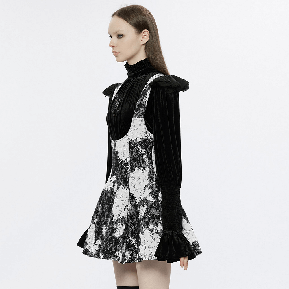 Side view of a model in a Gothic black and white floral dress with ruffled sleeves and a fitted bodice.