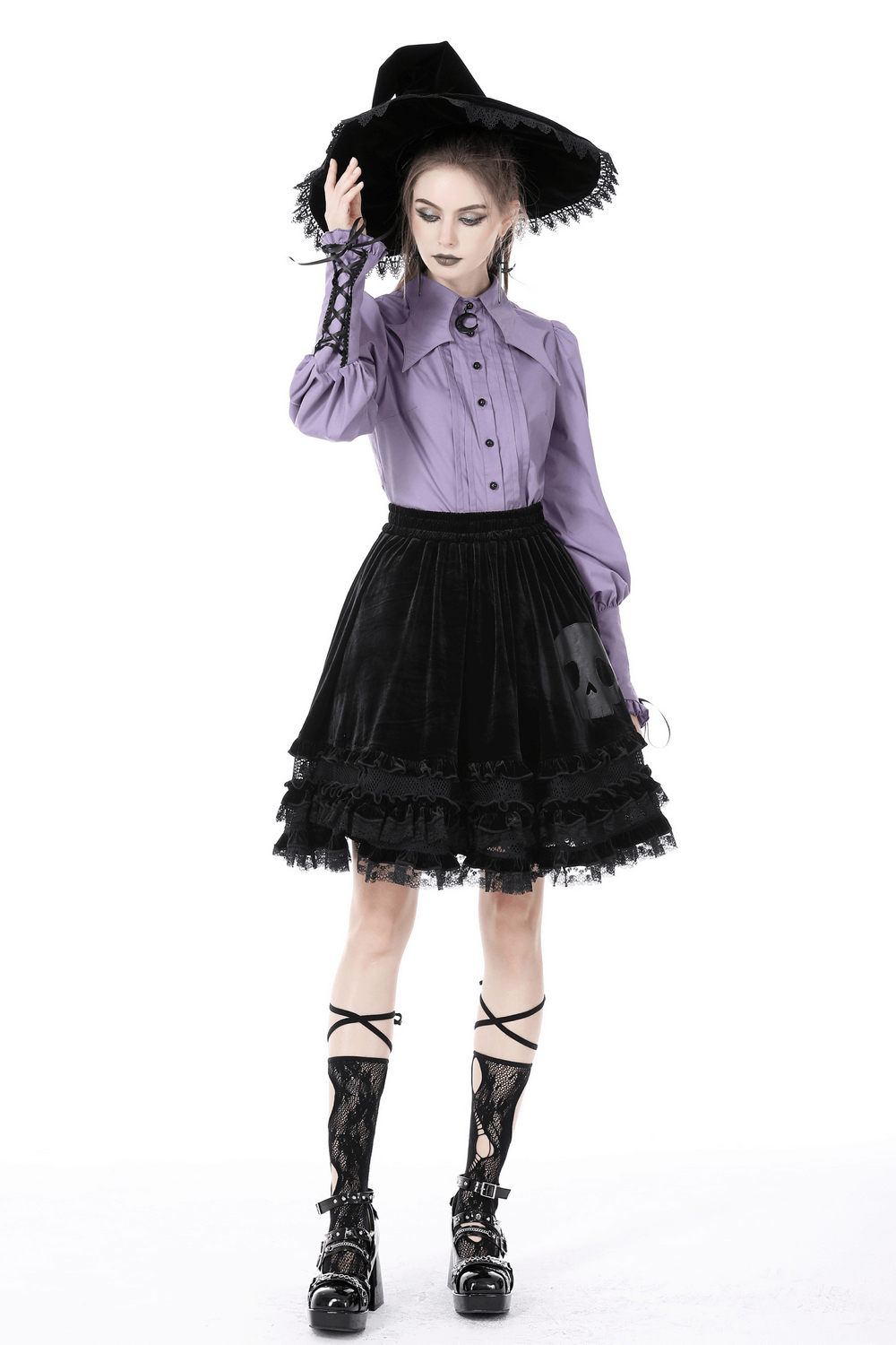 Chic model in a Victorian-inspired elegant purple blouse and black ruffled skirt, adding a touch of gothic style.