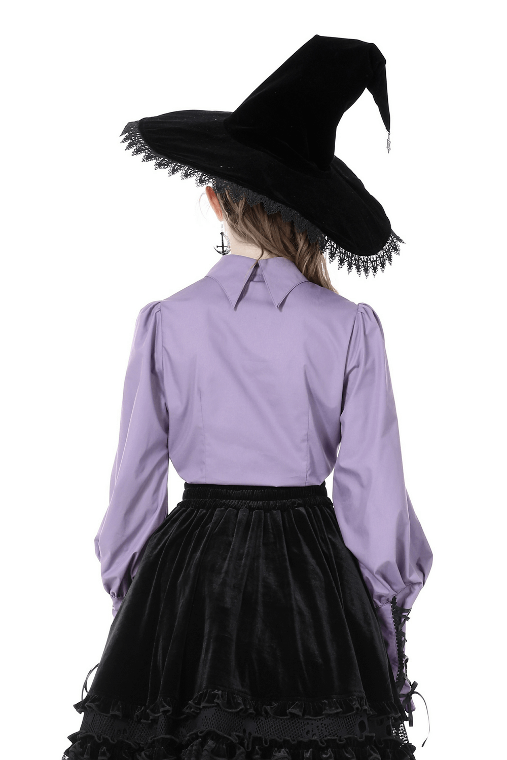 Back view of a girl wearing an elegant purple blouse with ruffled sleeves and a black witch hat.