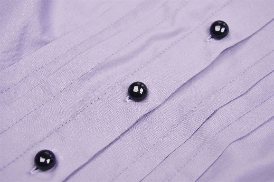 Close-up of elegant lavender blouse fabric with pin-tucked detail and black buttons for stylish Victorian-inspired look.