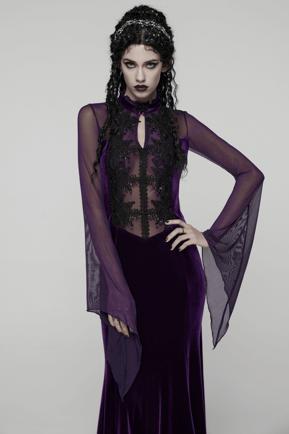 Elegant Purple Velvet Maxi Dress with Lace and Mesh worn by a model with a dramatic look and flowing sleeves.