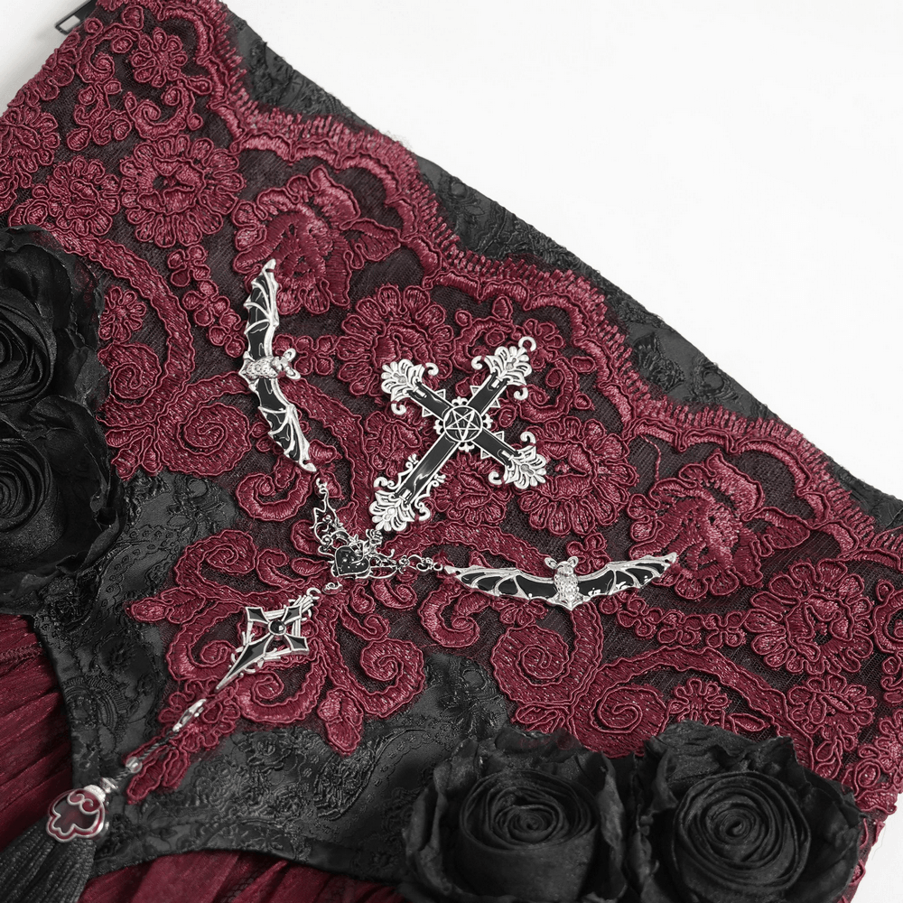 Alt Tag: Elegant Red-Black Gothic Lace Corset Belt with Overskirt close-up, red embroidered lace, silver cross detail, black rose accents