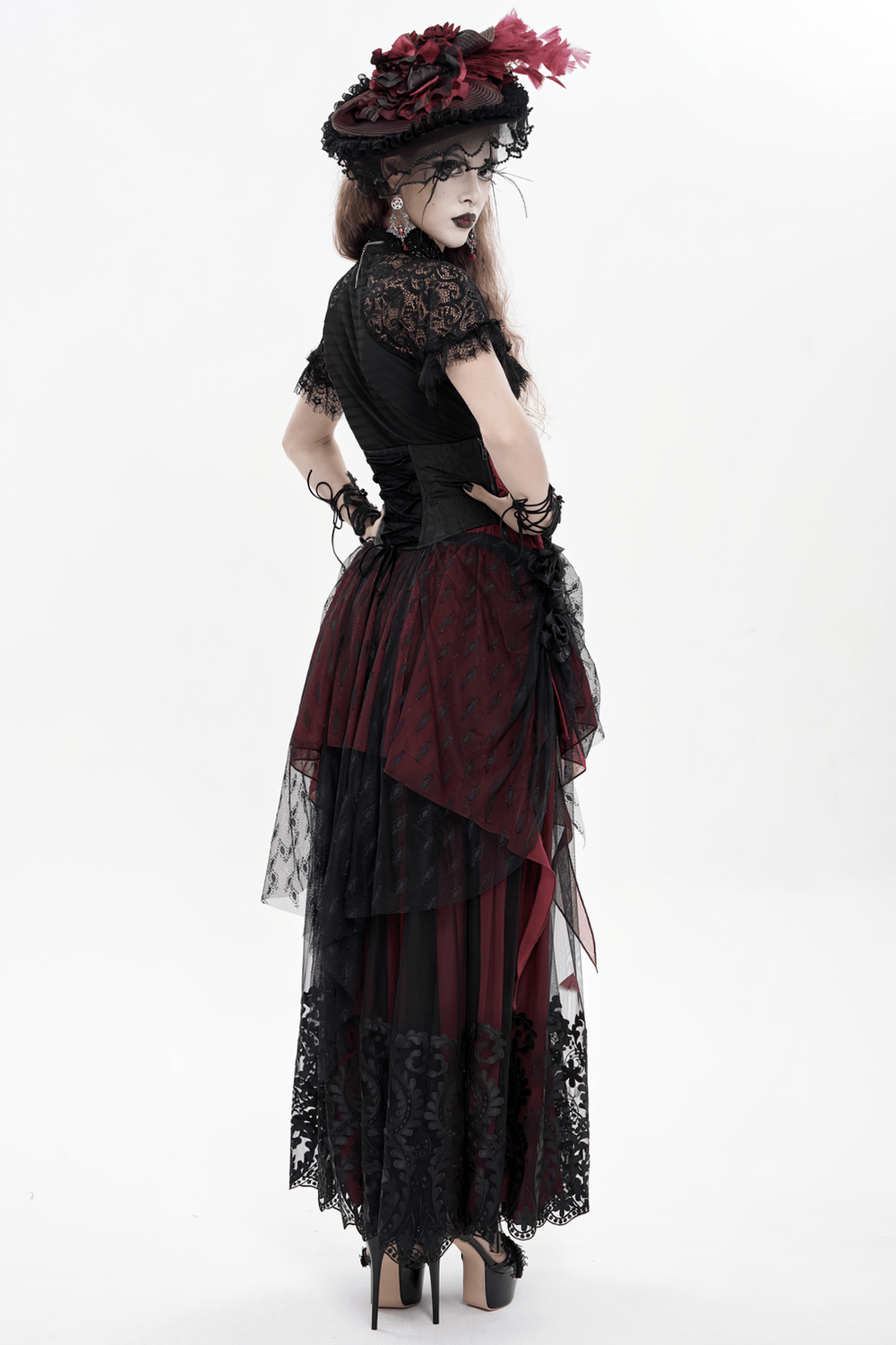 Alt Tag: Elegant Red-Black Gothic Lace Corset Belt with Overskirt worn with Victorian dark romance bustle train skirt, dramatic red-black lace layers