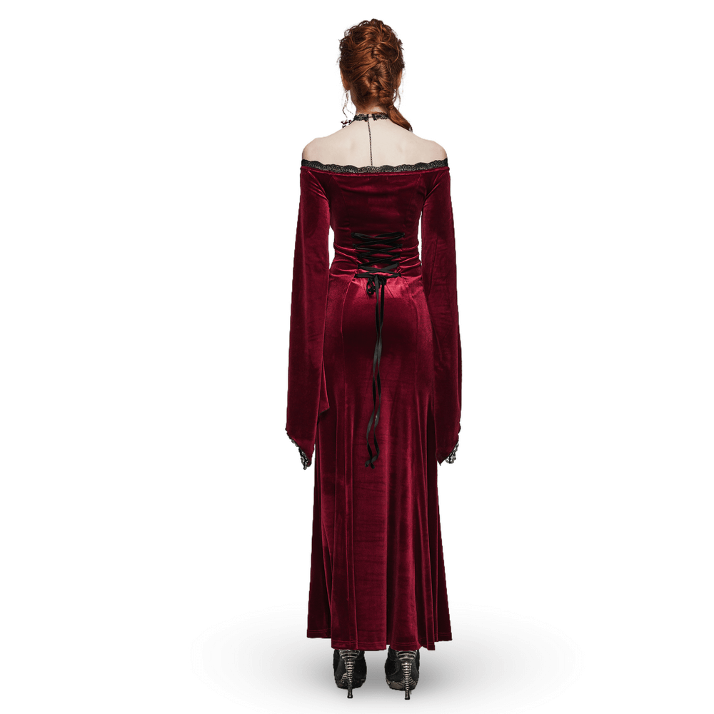 Back view of an elegant red velvet gothic dress with lace sleeves and lace-up detail.