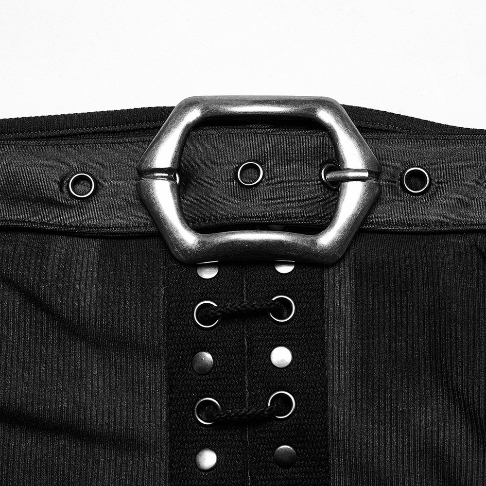 Detail of a stylish black ribbed dress with a bold silver buckle and eyelet fastening.