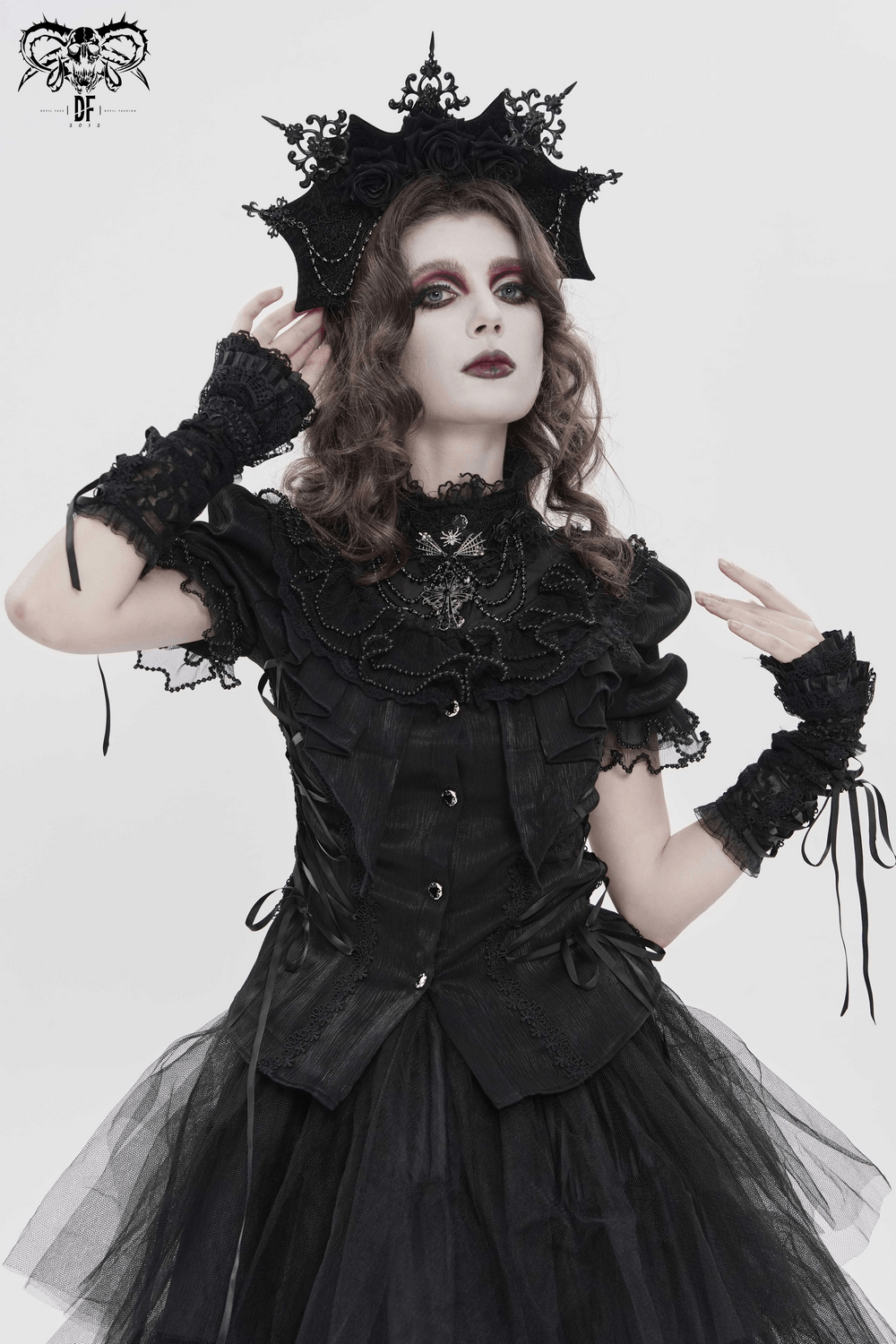 Elegant Ruffle Blouse with Sheer Yoke and Lace-Up Sides showcased on a model with gothic styling and dramatic makeup.