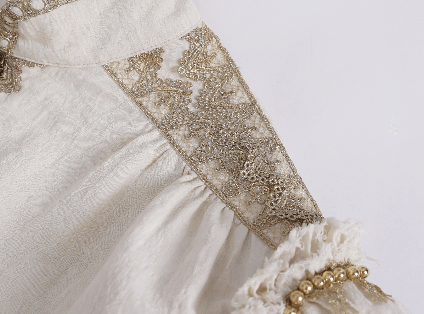 Elegant cotton shirt featuring intricate lace details and vintage ruffles, ideal for any occasion.