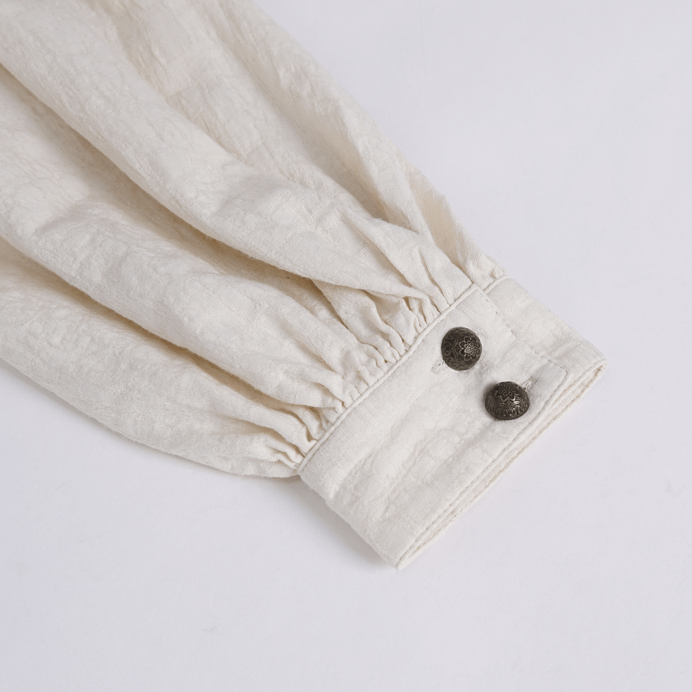 Elegant ruffled cotton shirt sleeve detail with unique button accents for vintage charm.