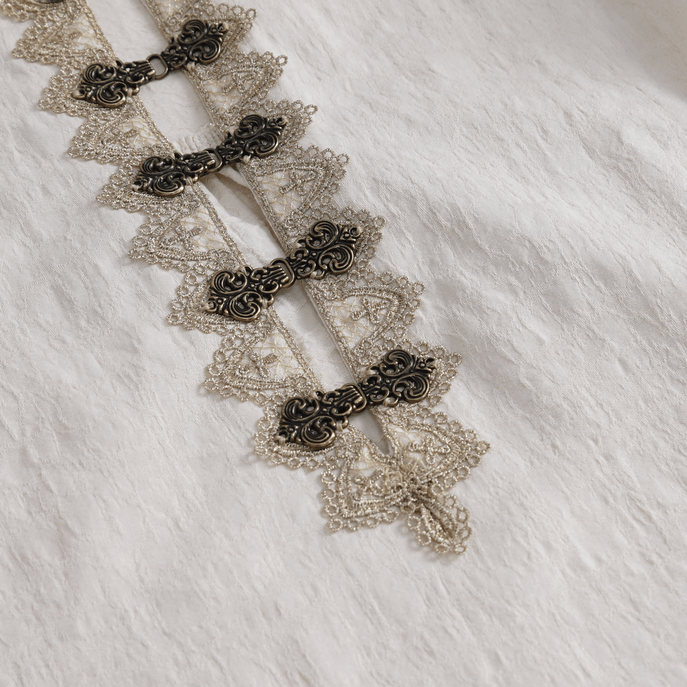 Close-up of vintage lace detailing on elegant cotton shirt with beaded accents.