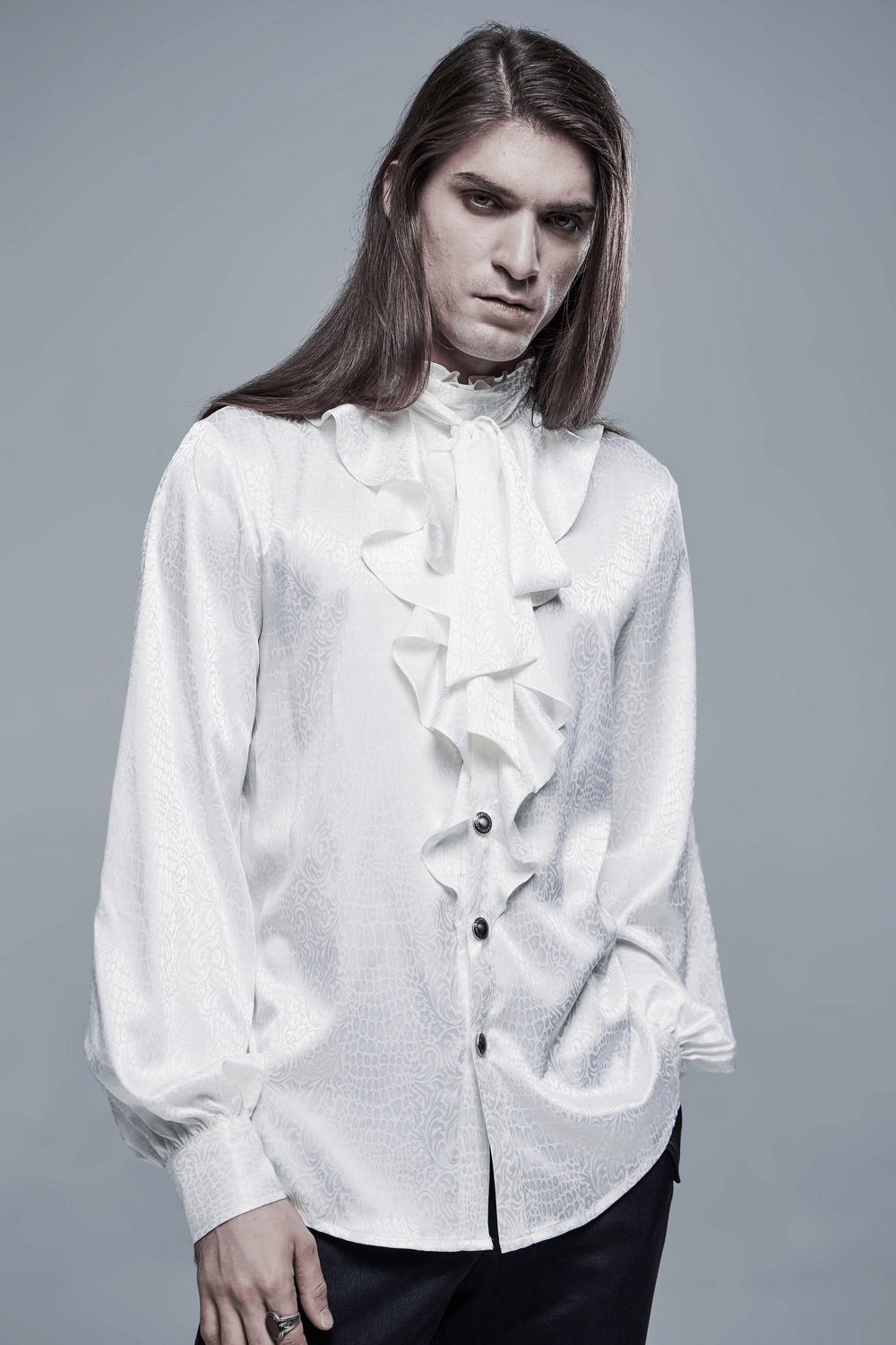 Stylish model wearing an elegant ruffled gothic blouse, showcasing intricate details and sophisticated fashion.
