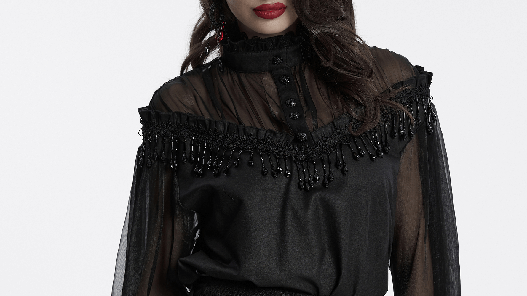 Elegant sheer black blouse with tassels and lace details, featuring an off-shoulder design and luxurious gothic style.