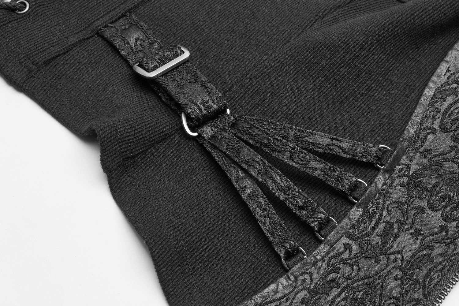 Close-up of elegant steampunk waistcoat showcasing metal buckles and intricate jacquard fabric details.
