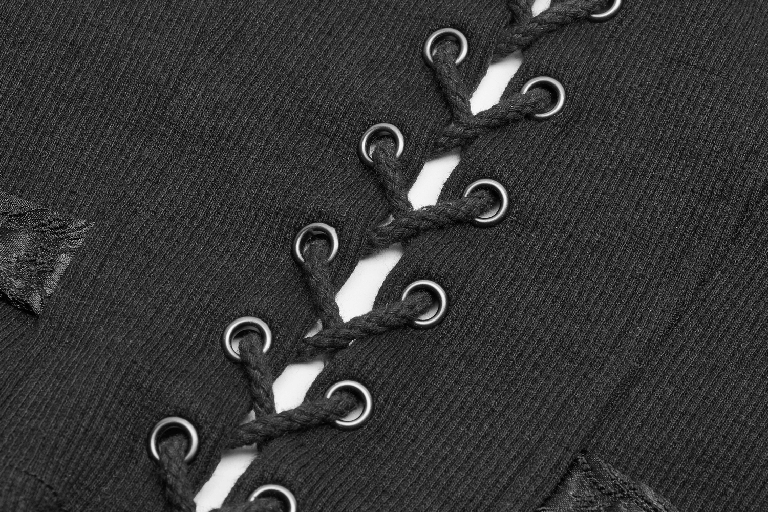 Close-up of a black Steampunk waistcoat showcasing intricate lacing and metal grommets for added style.