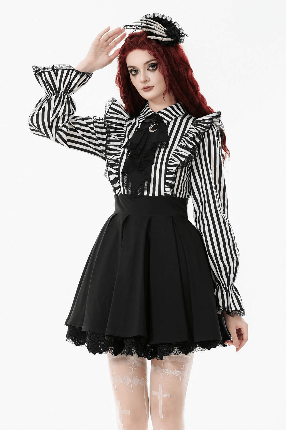 Elegant Striped Dress with Ruffle Sleeves and Moon Detail worn by a model, showcasing gothic fashion with black and white stripes.