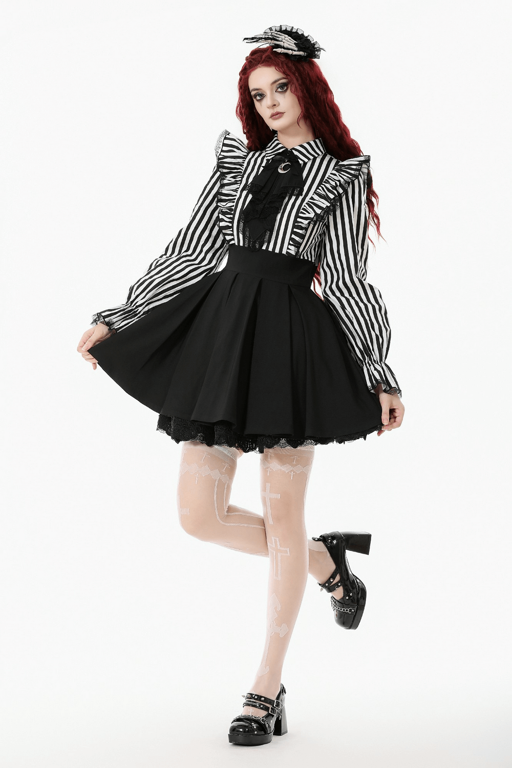 Elegant Striped Dress with Ruffle Sleeves and Moon Detail worn by a model with dramatic gothic style.
