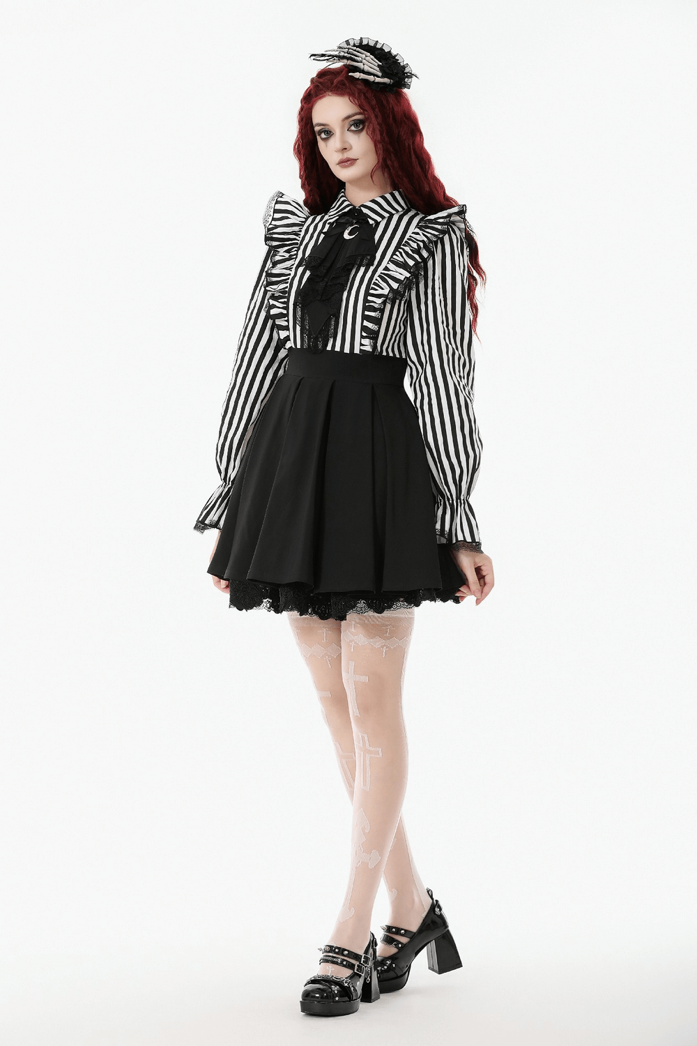 Elegant Striped Dress with Ruffle Sleeves and Moon Detail worn by a model in a gorgeous gothic style.