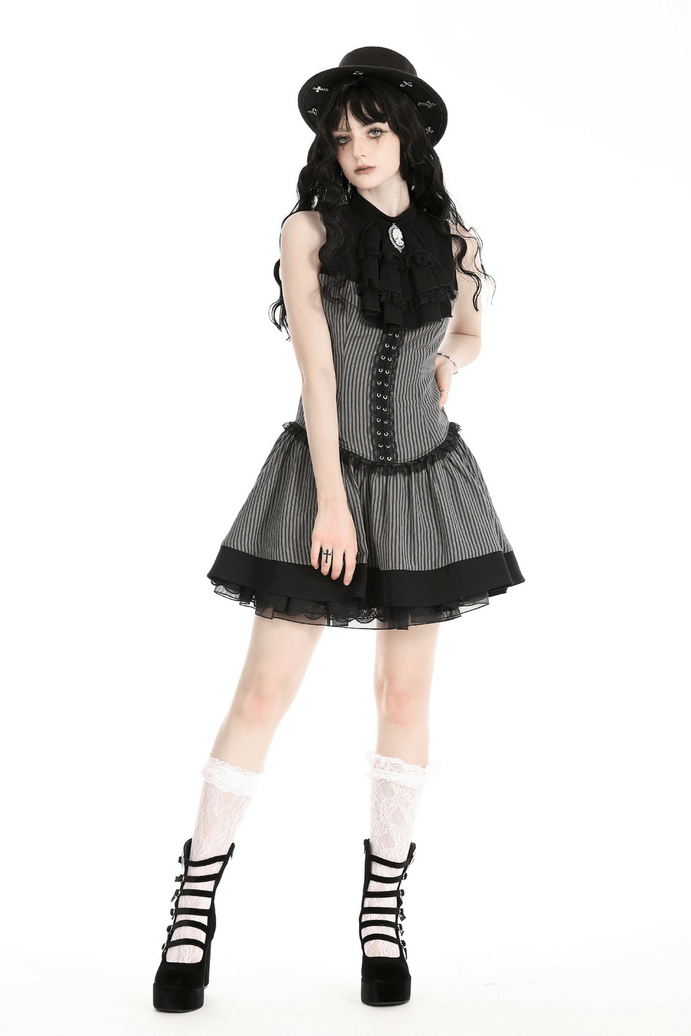 Chic sleeveless striped dress with ruffles and brooch, perfect for gothic-inspired fashion.