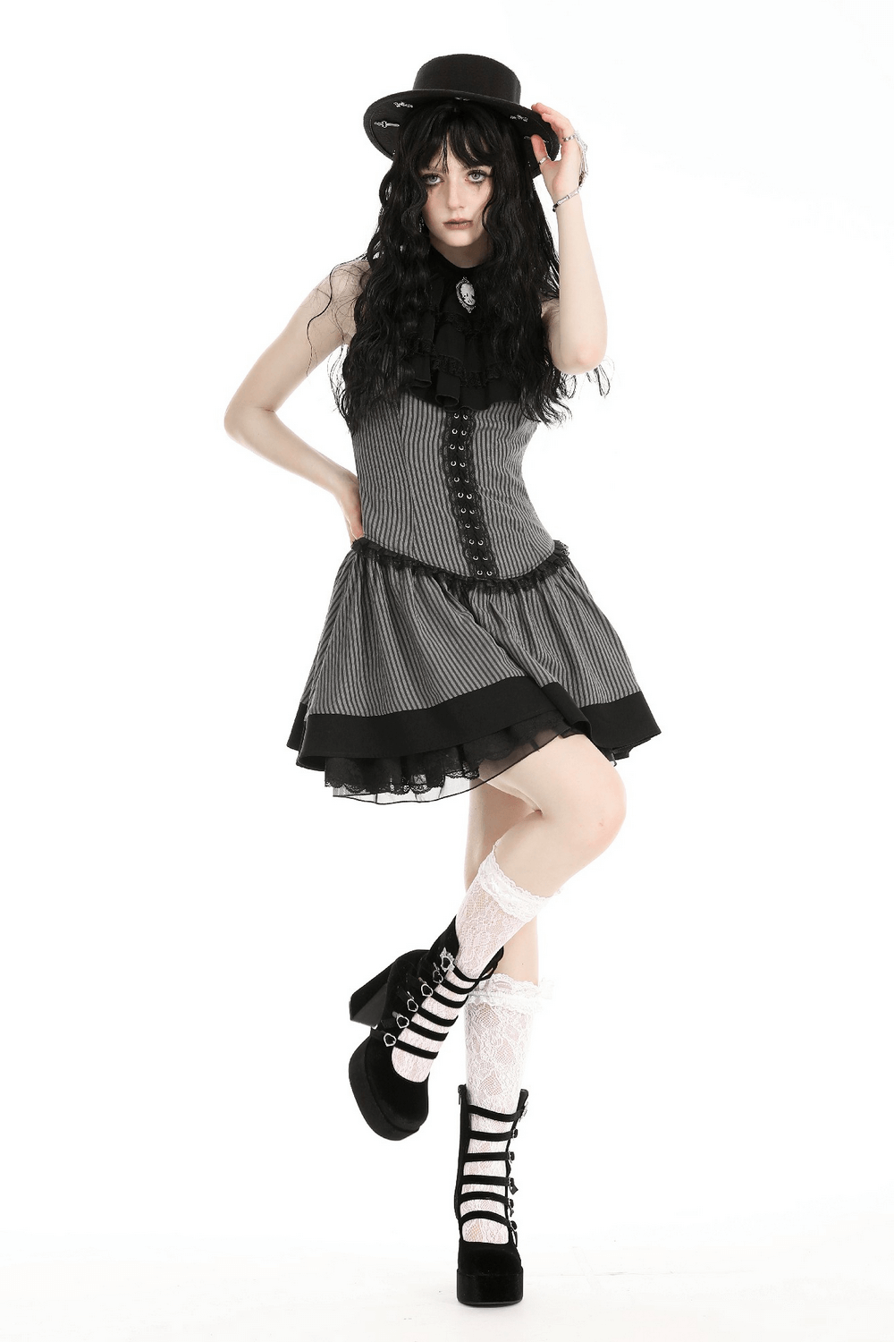 Chic gothic-inspired dress with ruffles, buttons, and stylish hat, perfect for making a bold fashion statement.