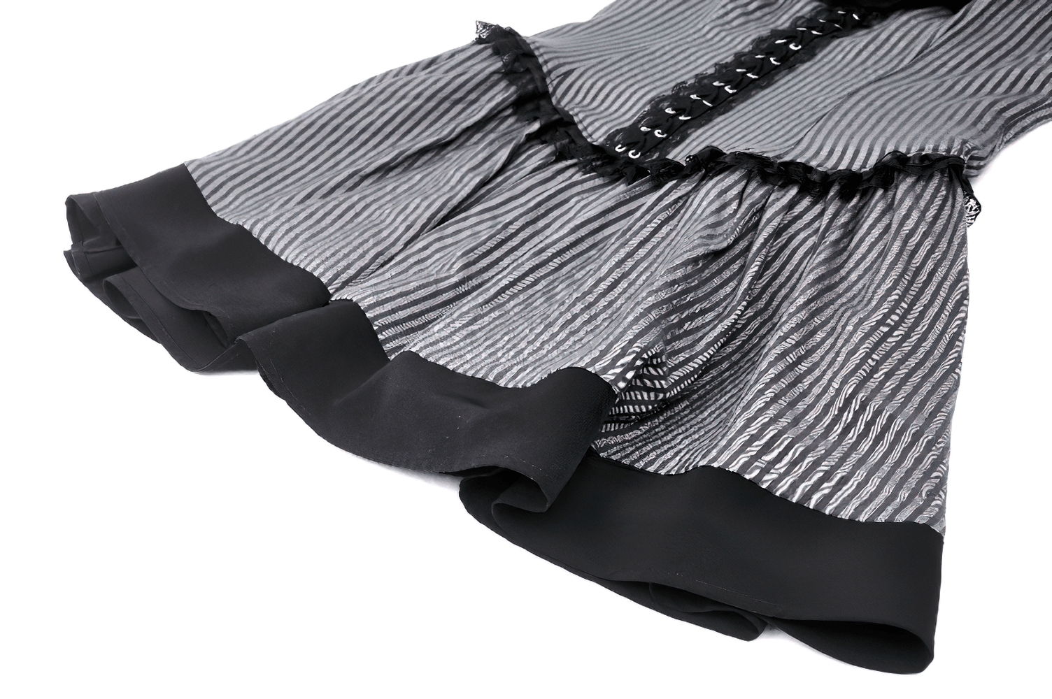 Elegant striped ruffle dress showcasing black ruffles and button detail, perfect for a chic gothic look.