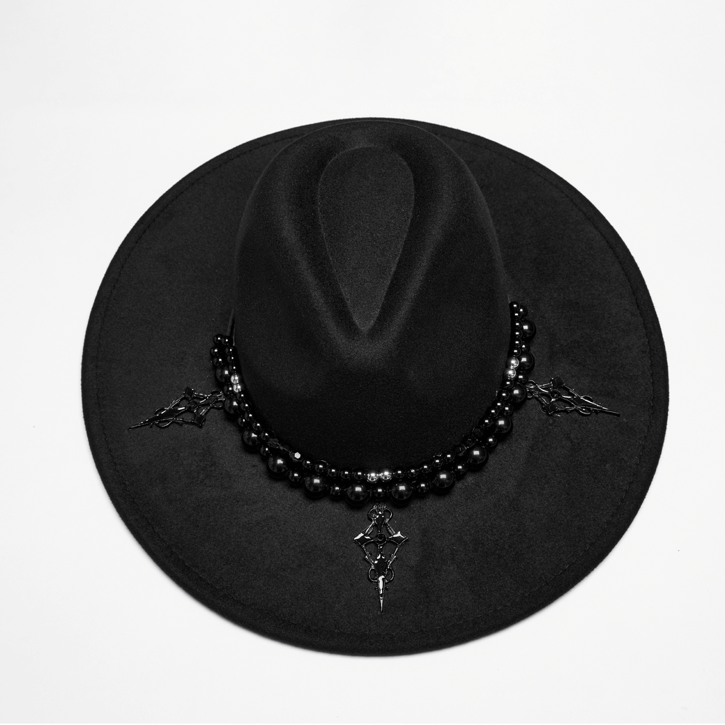 Elegant black suede wide brim hat with gothic pearl accents and Satan's cross details, perfect for bold fashion statements.