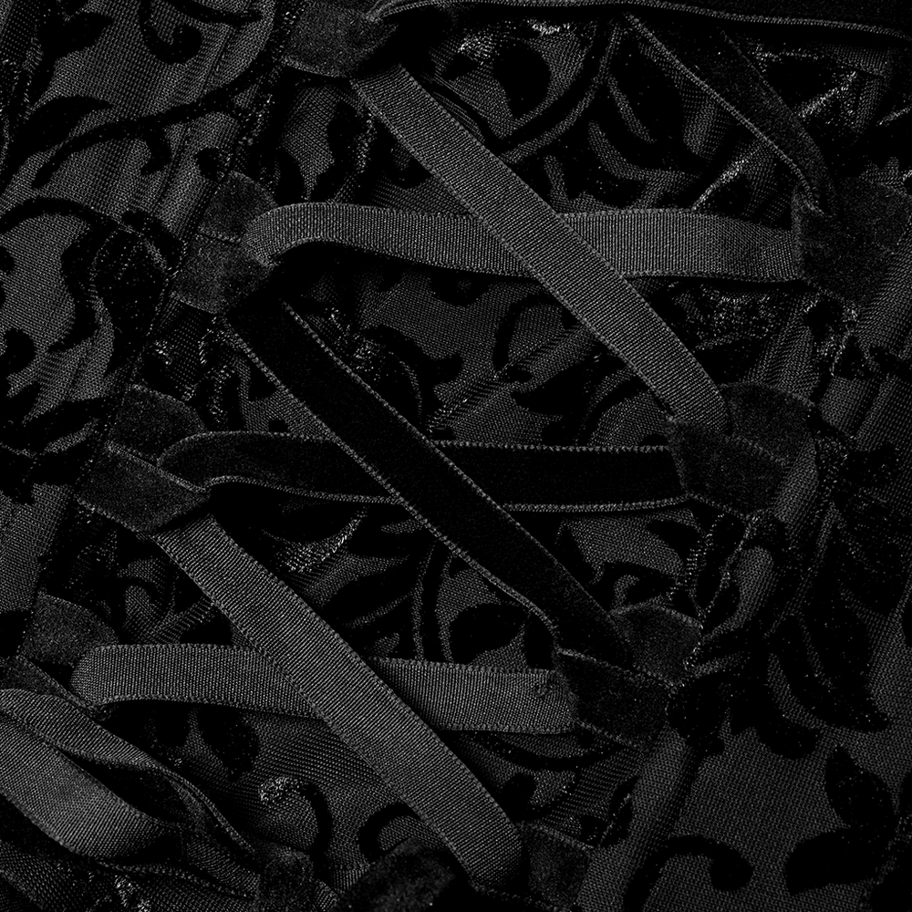 Close-up of gothic velvet detail with drawstring design on an elegant bridal gown.