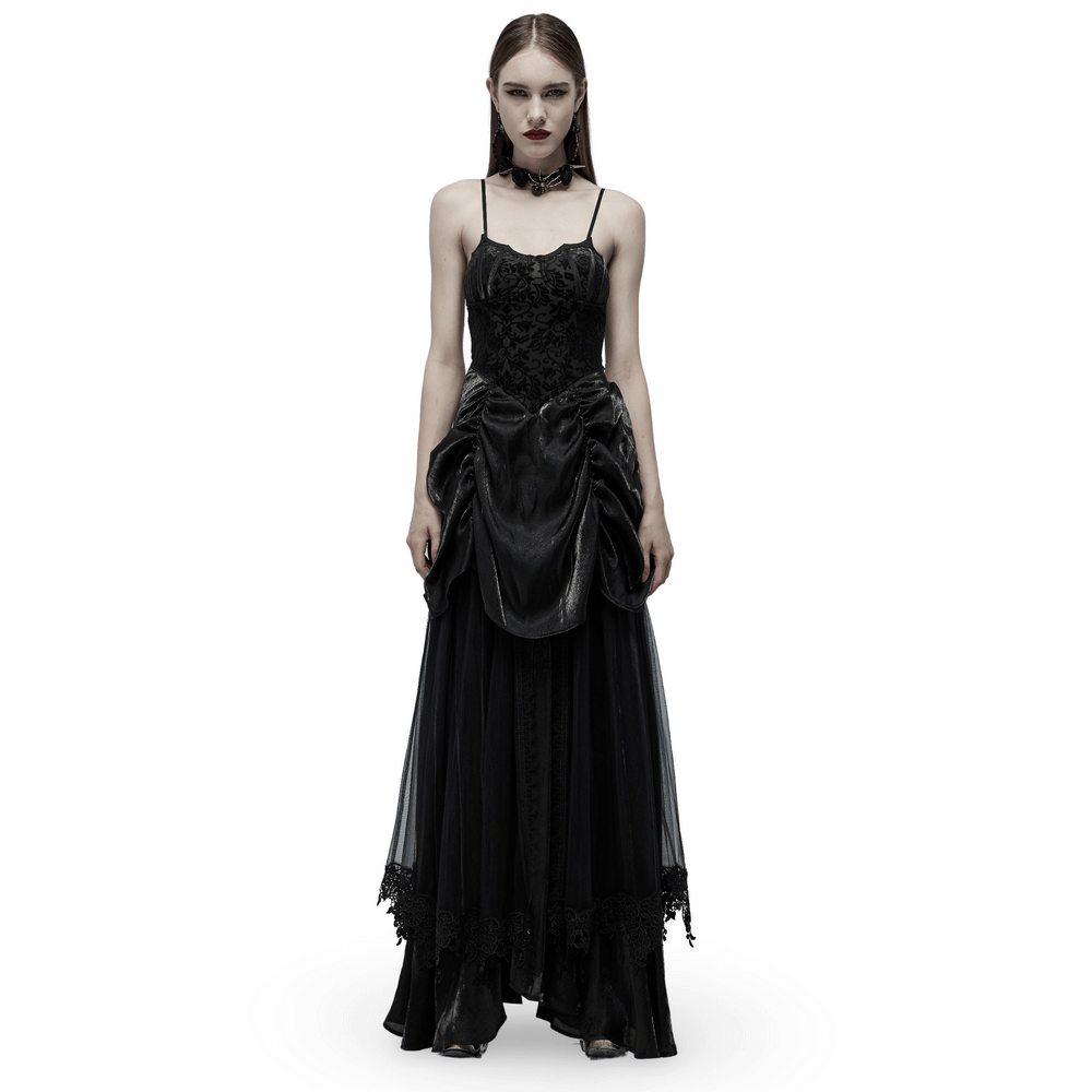 Elegant gothic bridal gown with tulle and velvet, featuring a bat motif and dramatic bustle for a majestic look.